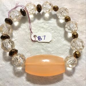 Artemis's Gems custom-made beaded bracelet with metal beads and large gold gem